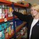 Emily Attwell sorting food items for Food Bank collections.