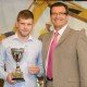 POI apprentice Daniel Morris accepting his award from RAF pilot and broadcaster John Nichol at the National Construction College East.