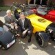 Paul Keeling, of UKTI West Midlands (back), and Julian Turner, of Westfield Sportscars Ltd, with some of the hand-built luxury vehicles.