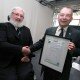 Coventry University Vice-Chancellor John Latham receives his Honorary Fellowship from Alan Chantler of BCS.